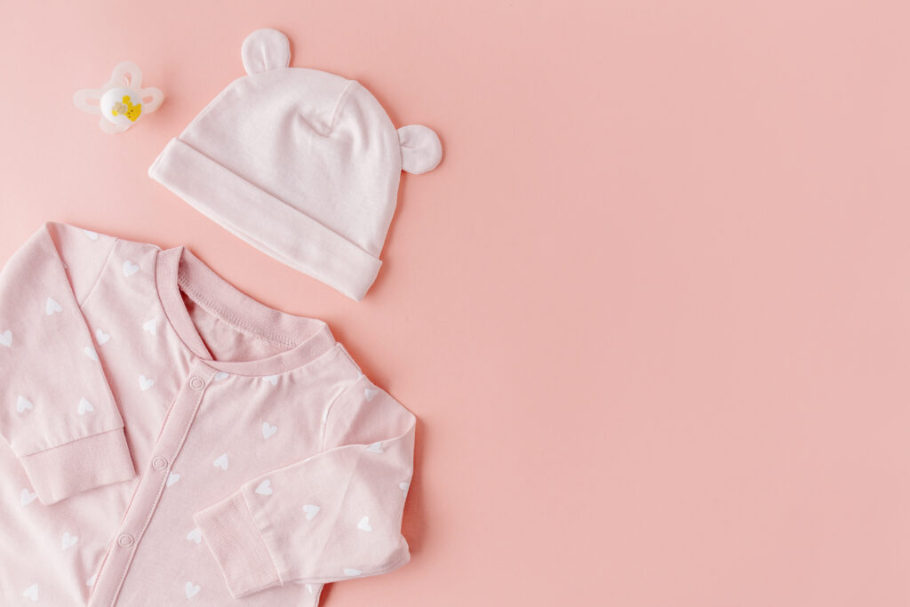 baby goods on pink background